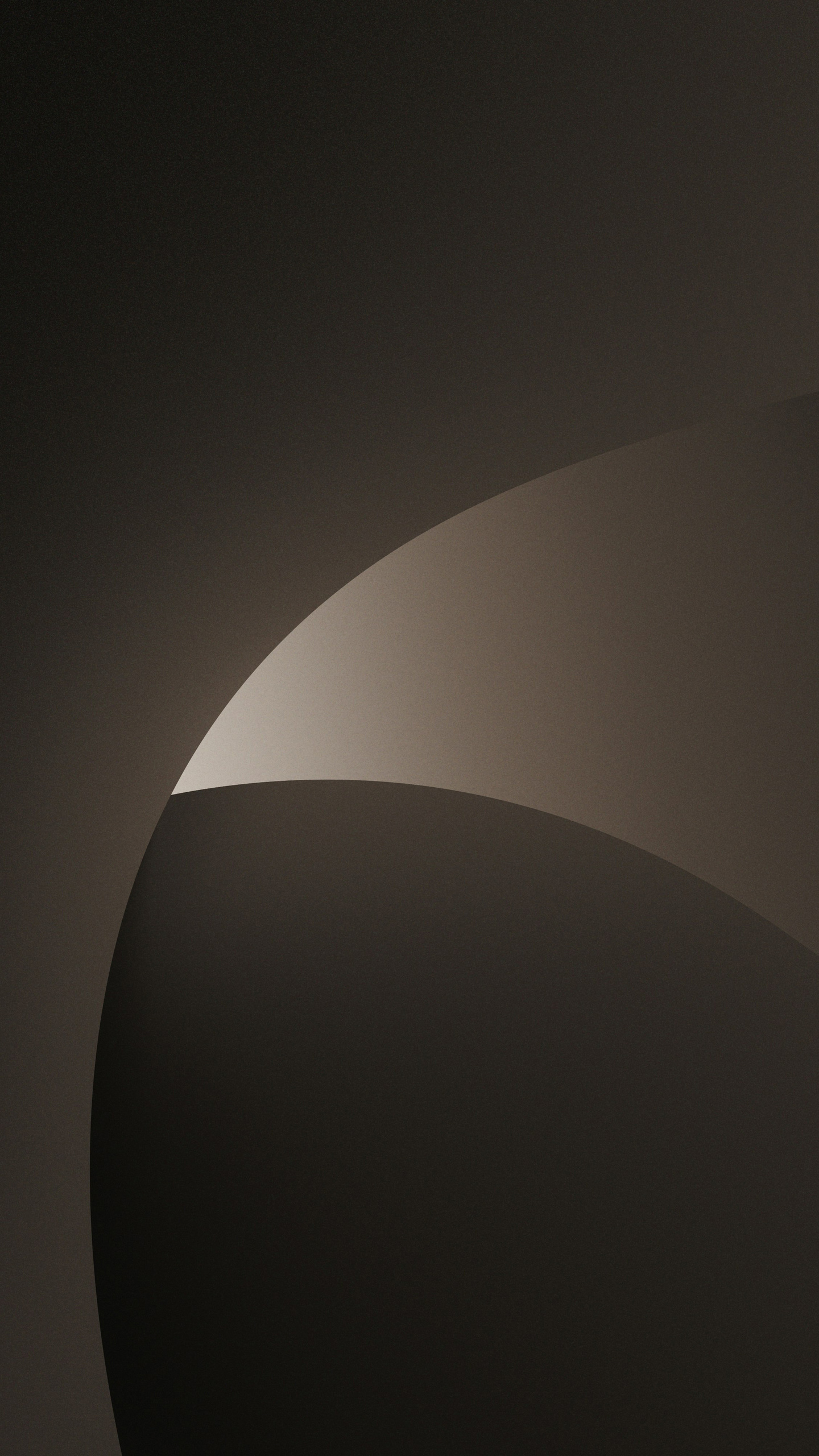 A curved shape in a gradient of brown and black hues.