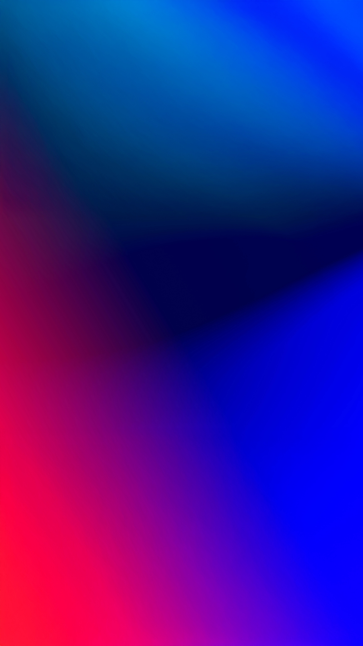 A vibrant gradient of blue, purple, and red hues fills the frame, creating a mesmerizing display of color.