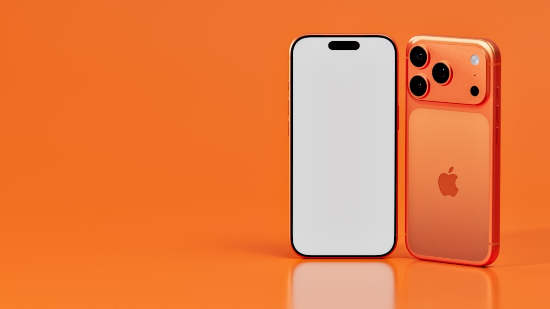 A sleek iPhone stands out against an orange background, its back gleaming with an apple logo.