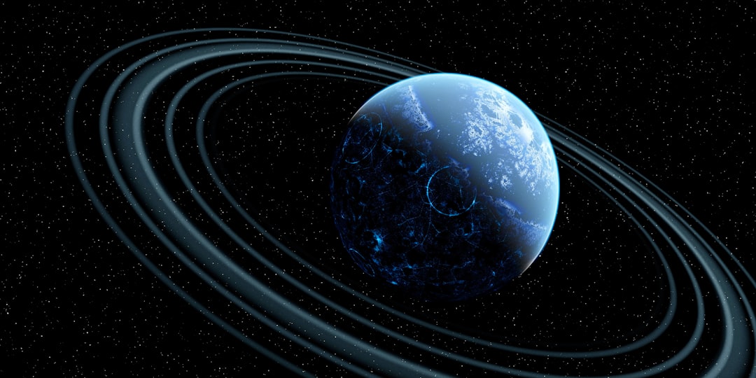 A blue planet with rings, set against a starry backdrop.
