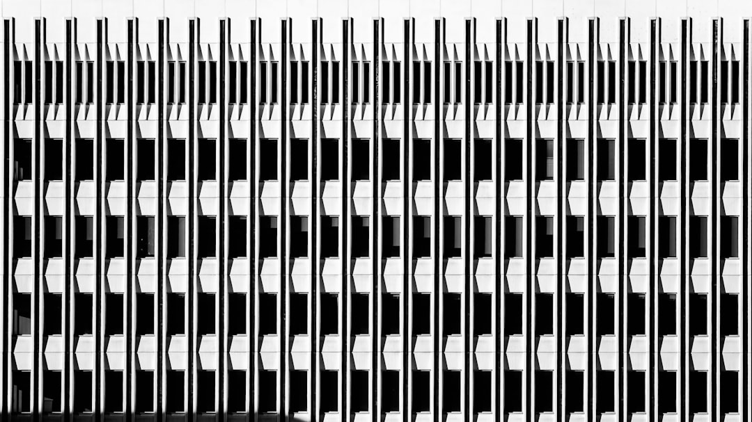 A symmetrical pattern of vertical lines and hexagons creates a striking visual effect.