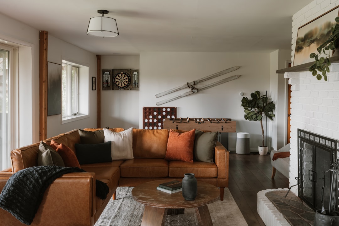 A cozy living room with a warm, inviting atmosphere, featuring a comfortable couch and a fireplace.
