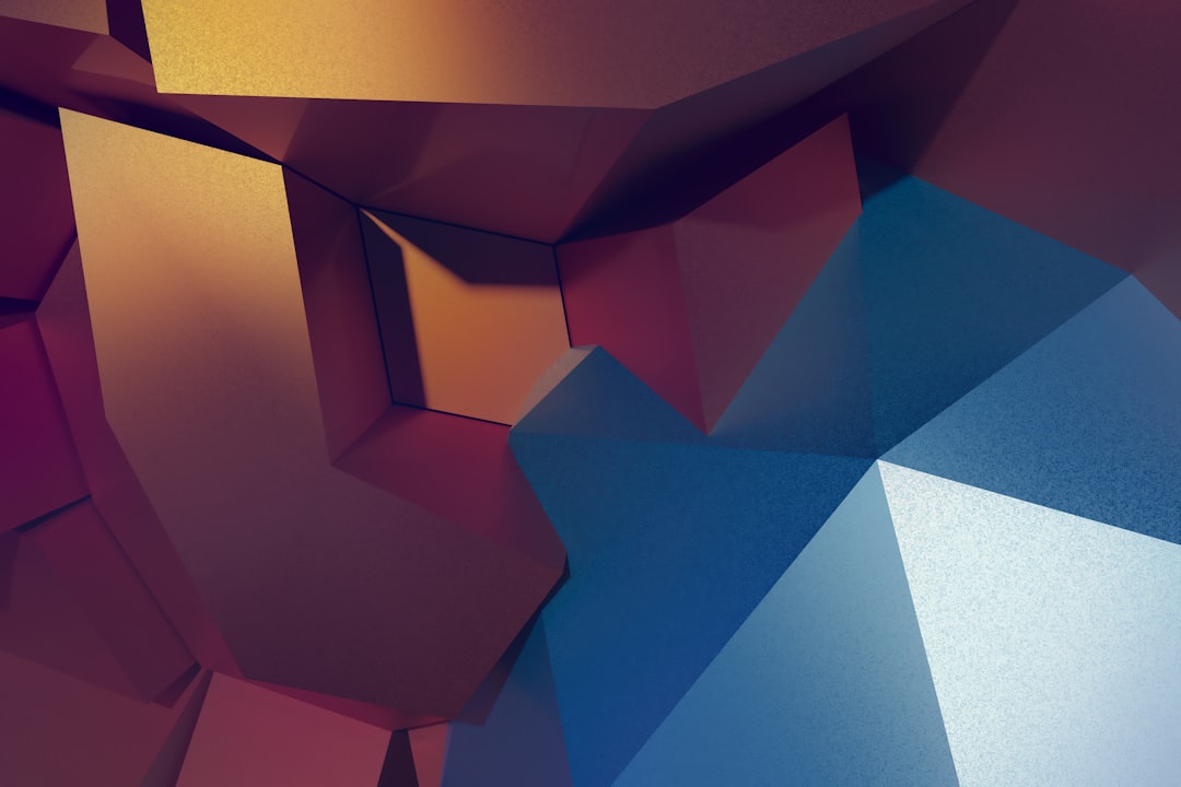 Abstract geometric shapes in shades of blue and red.