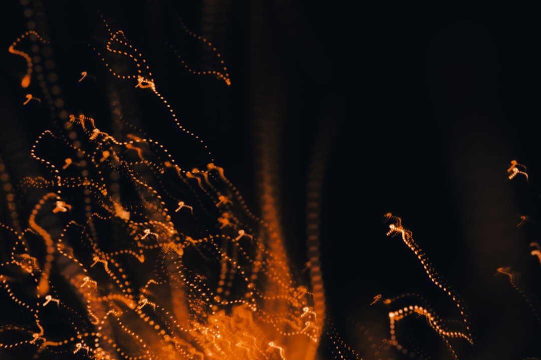 Golden sparks dance in the darkness.