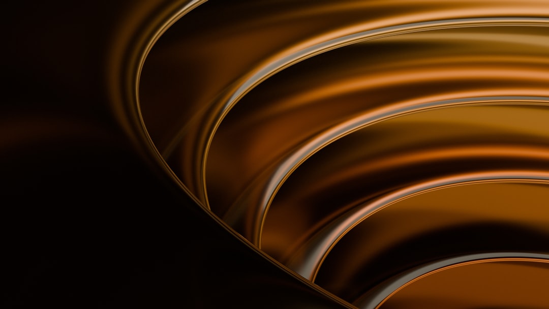 Dark, glossy rings radiate against a black background.