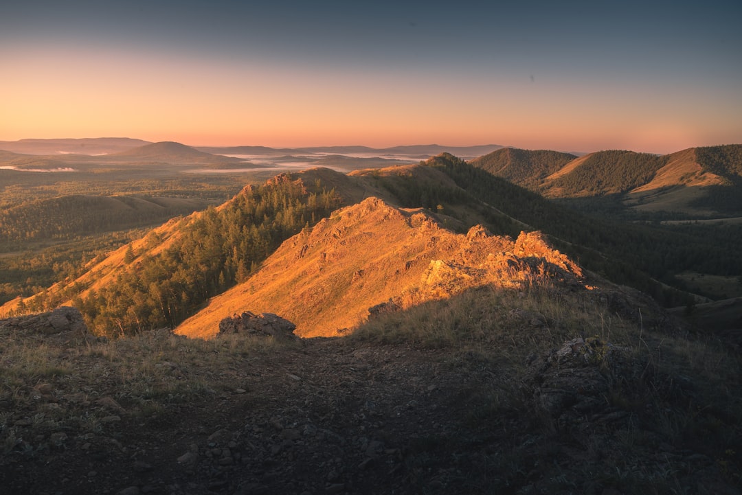 Golden mountains bathed in sunset light.