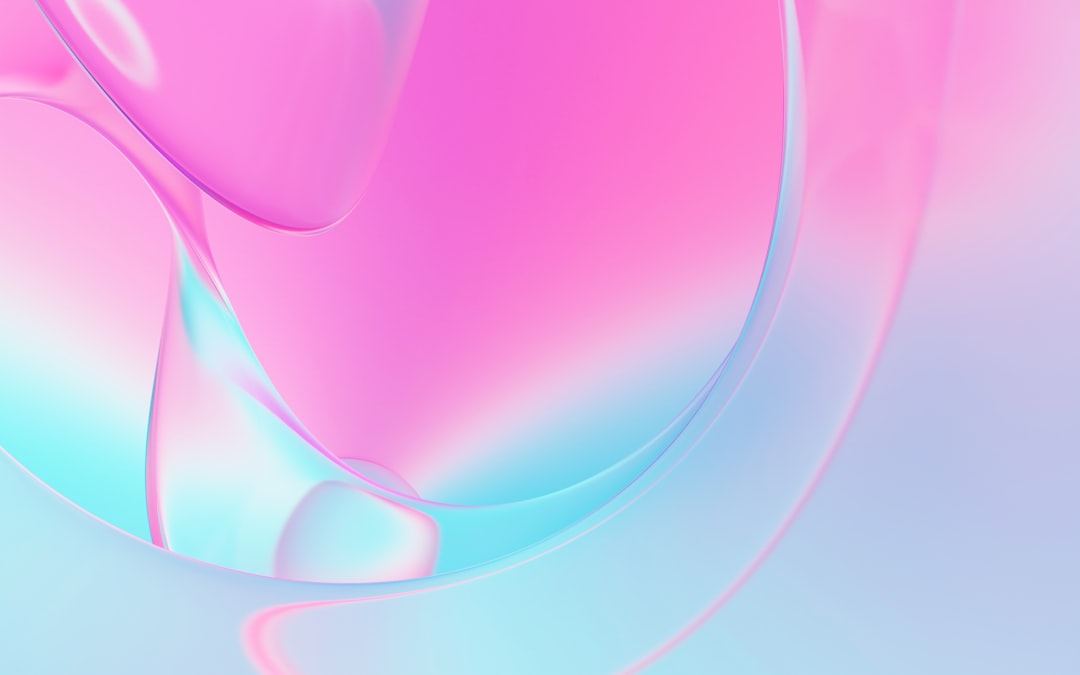 Soft pink and blue hues blend in a fluid, abstract pattern.