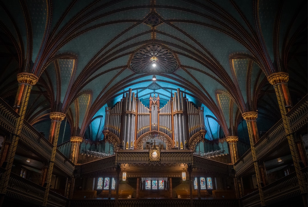 A majestic pipe organ takes center stage in a grand, ornate room, its intricate details and soaring pipes a testament to its beauty and craftsmanship.
