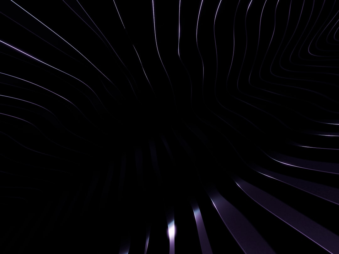 Dark purple lines radiate from the center, set against a stark black background.