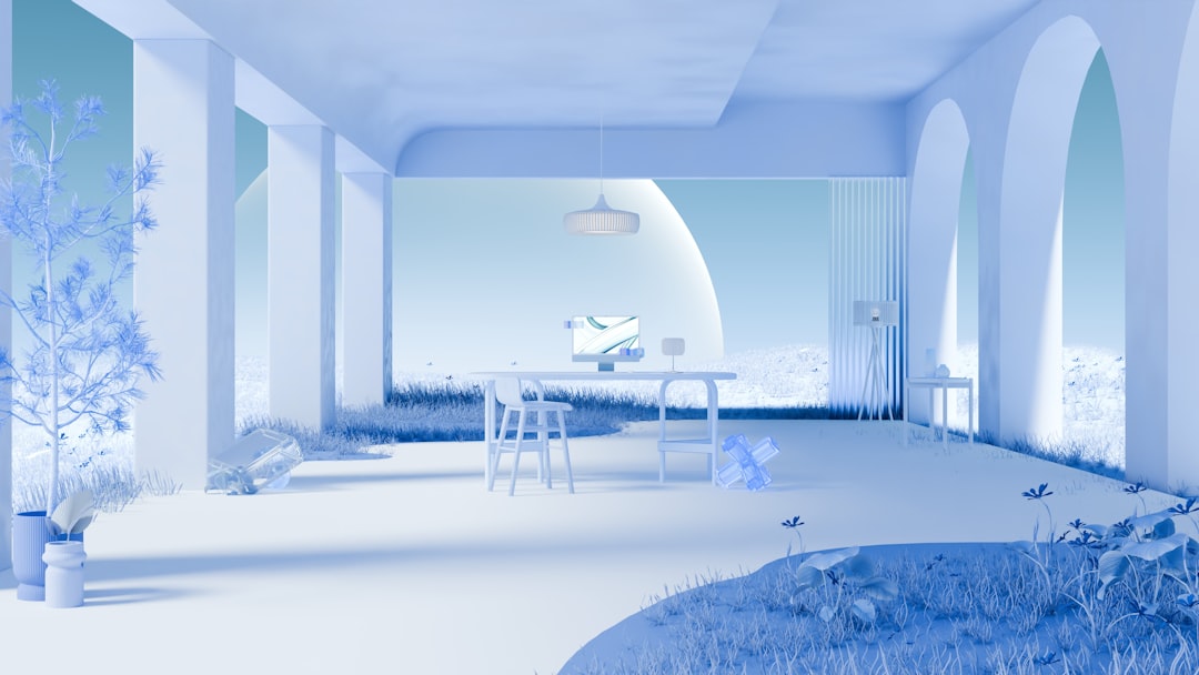 A serene white room with a desk and computer, surrounded by natural elements and soft lighting.