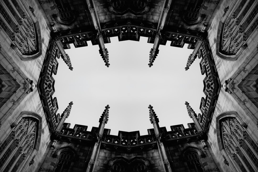 A symmetrical stone building with intricate carvings and ornate details.