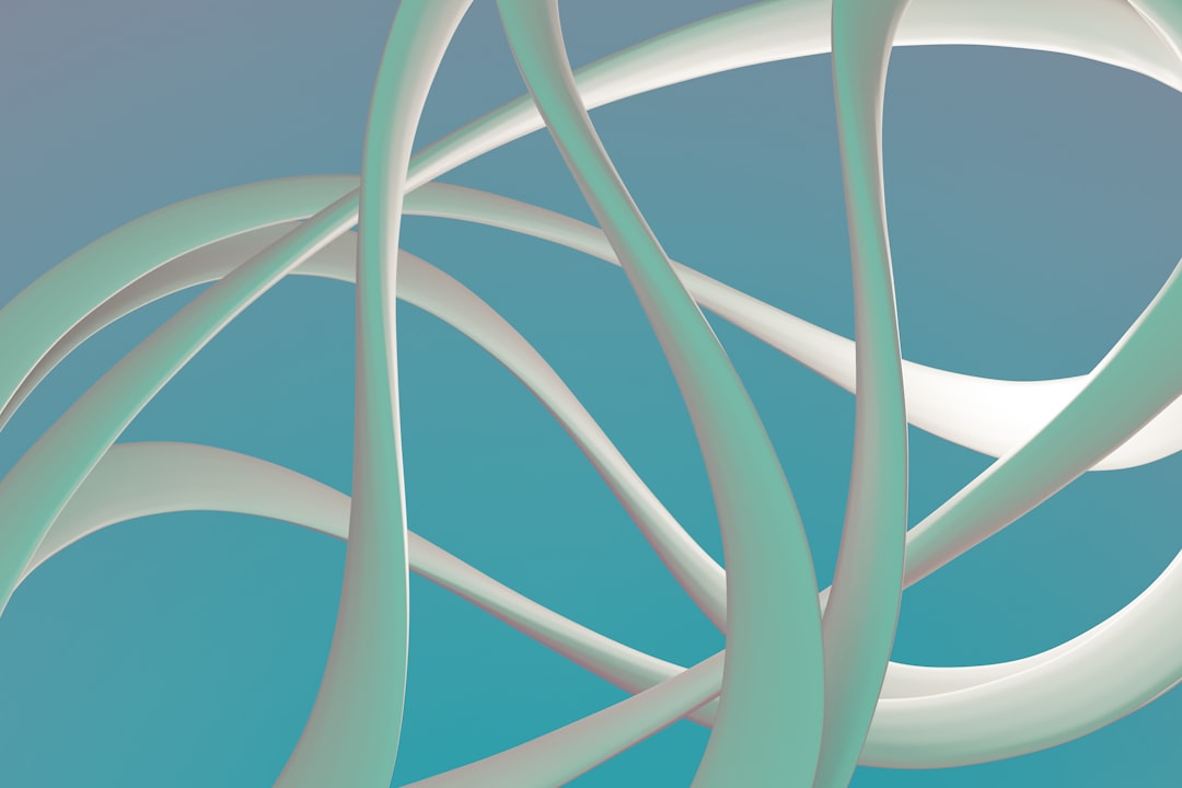 A vibrant blue-green abstract art piece, featuring intertwined white and blue-green curved lines.