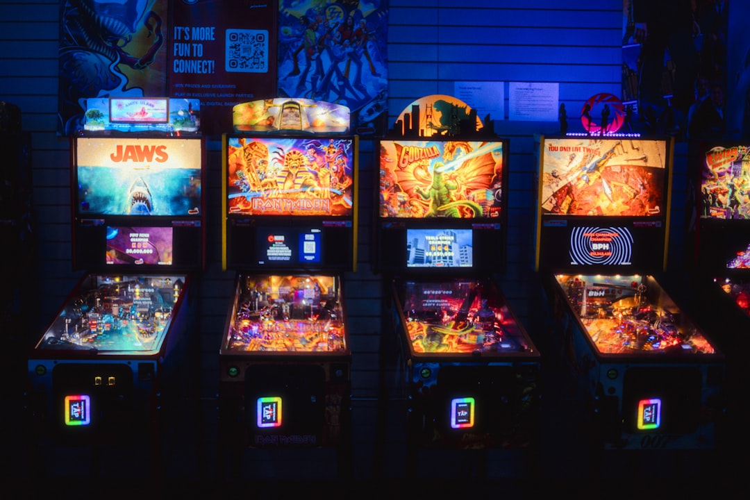A vibrant arcade room with a variety of colorful pinball machines.
