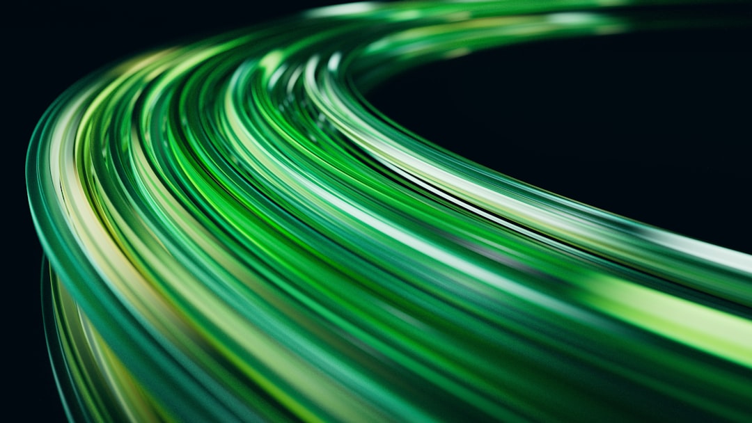 A vibrant green, curved line of light against a black background.