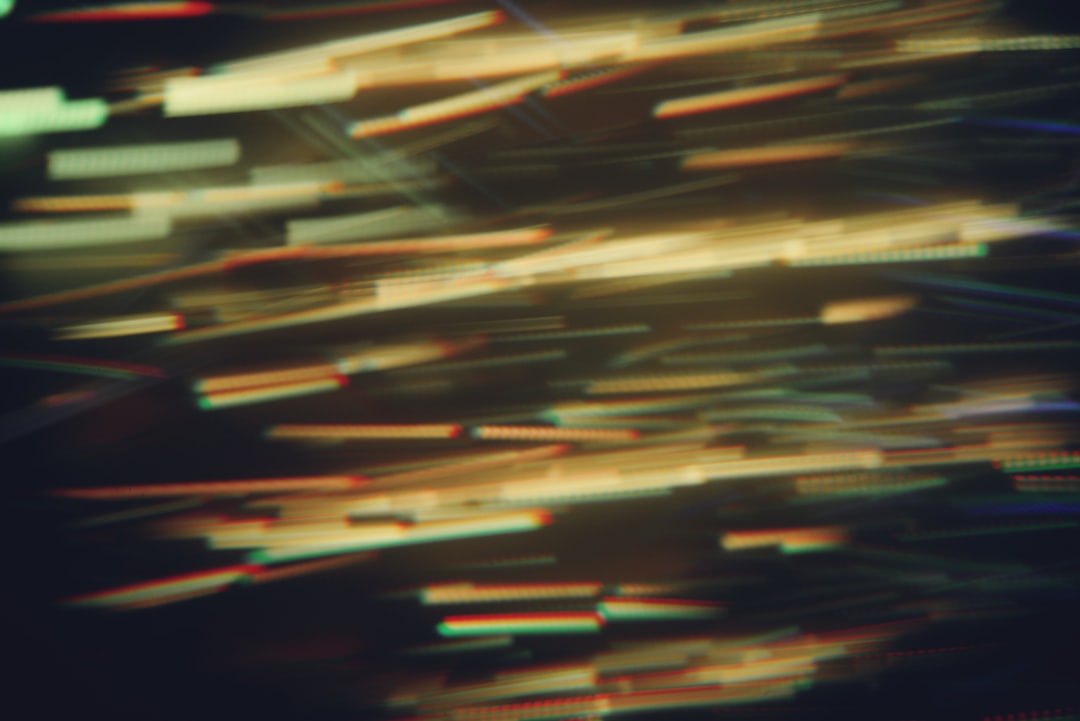 A vibrant array of neon lines and dots, reminiscent of a cityscape at night, radiates with an otherworldly glow.